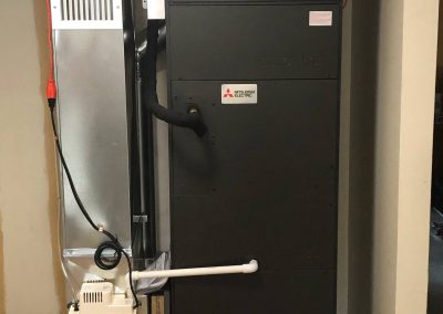 heat pump indoor unit with duct beside it